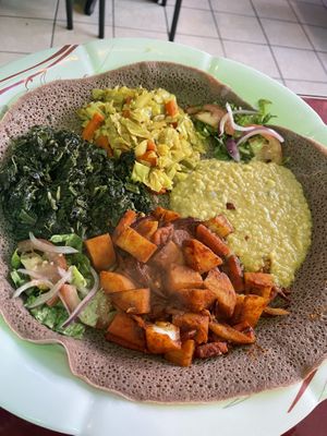 Full entree portions of Spicy Dinich Wot, Quosta, Tikil Gomen, and mild Ye Misir Wot  at Major Restaurant in Indianapolis