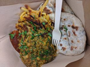Spinach and chickpea dahl, sourdough naan, bhaji and mango chutney (100% vegan). at Laggan Wolftrax Cafe in Laggan