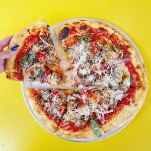 SPICY SAUSAGE PIZZA: beyond sausage, mushroom, red onions, marinara, cashew mozzarella, Calabrian chili, basil at Wildseed in San Francisco