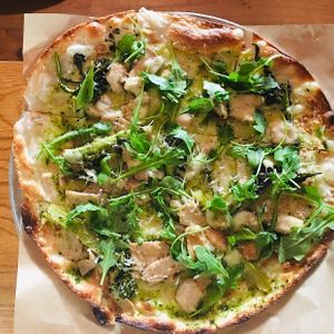 Green Forest Flatbread, broccolini, king mushroom, chimichurri, smoked mozzarella, arugula at Wildseed in San Francisco