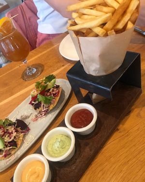 Bugle fries with flight of sauces  at Wildseed in San Francisco