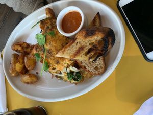 Just Egg omelette w/ impossible foods sausage, vegan cheese, winter veggies, and a spicy tomato sauce (ordered on the side). With wonderfully prepared fingerling potatoes & toast. at Wildseed in San Francisco