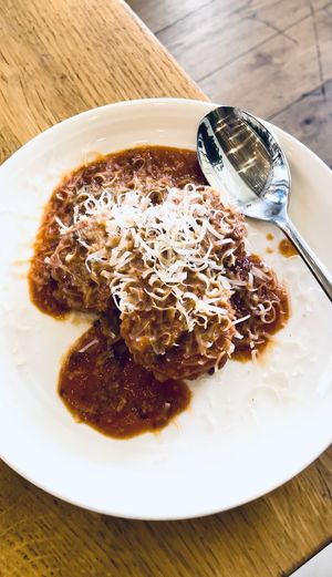 Polenta Cakes. Cashews, tomato and mushroom ragu, garlic, vegan parmesan  at Wildseed in San Francisco
