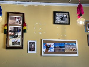 Wall of llama photos  at Llama Cafe in Uyuni