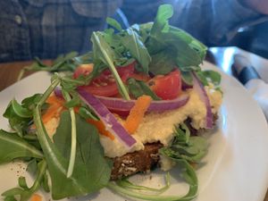 Loaded hummus toast!! Minus feta... at The Inkwell Bakery & Cafe in Bloomington