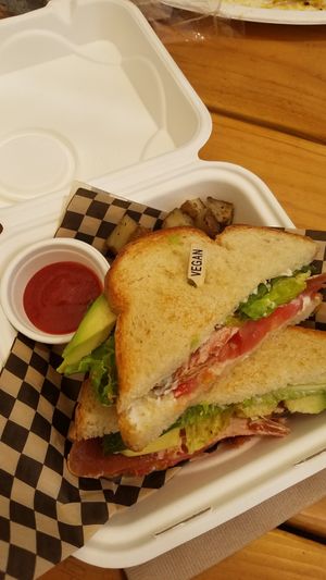 Vegan and crispy BLT with added breakfast potatoes. Love the "Vegan" toothpick! at Lively Up Yourself - Food Truck in Bend