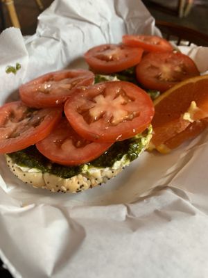 Everything bagel, vegan cream cheese, house made vegan pesto, tomatoes - YUM! at Highlands Cork & Coffee in Denver
