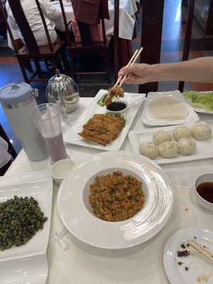 Fried green beans, fried soy sauce rice, vegan duck pancakes and steamed buns  at Gongdelin Vegetarian Restaurant in Beijing