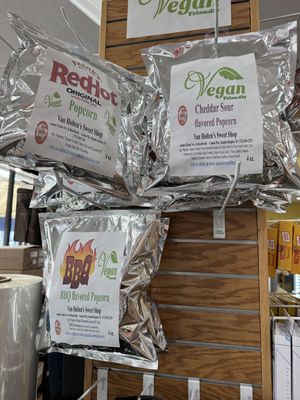 4 oz popcorn bags at the top of the column (franks red hot, cheddar sour and BBQ)  at Van Holten's Sweet Shop in Seaside Heights