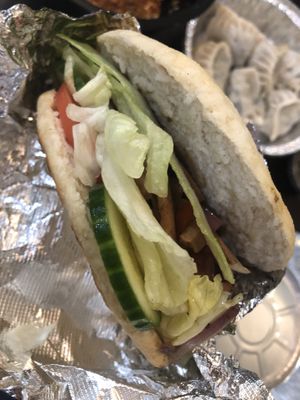 H1 xian burger single, with lettuce and cucumber and tomato   at Tofubox in Brooklyn