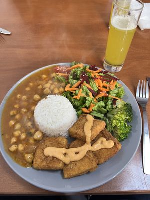Nuggets de tofu com molho Prema, arroz de coco, estufado de abóbora com grão de bico e salada   at Prema in Viseu