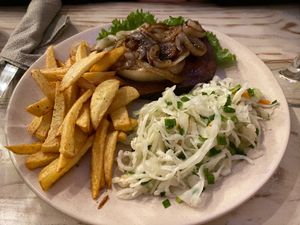 Seitan steak with French fries and cabbage  at VegaRoom in Lviv