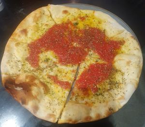 Starter: Garlic Pizza Tomato - Made with homemade pizza tomato sauce, garlic olive oil and a sprinkle of fresh basil at Giannis in Scarborough