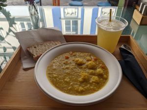 Daily stew: Indian Dahl with cauliflower, potato, carrots, delicious bread, lemon and lime drink at Oaza Joyful Kitchen in Zagreb