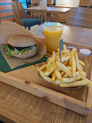 Sunny love burger, delicious fries, and the most amazing mango lassi at Oaza Joyful Kitchen in Zagreb