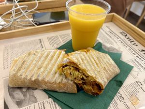 Wrap joyful seitan with homemade Mango lassi   at Oaza Joyful Kitchen in Zagreb