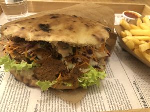 A wrap and fries that did their job nicely   at Oaza Joyful Kitchen in Zagreb