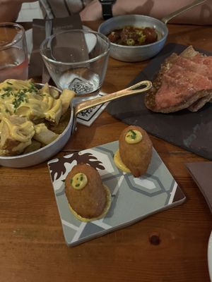 Patatas bravas with vegan sauce, “chicken” croquettes, pan con tomate   at Sensi Gourmet Tapas in Barcelona