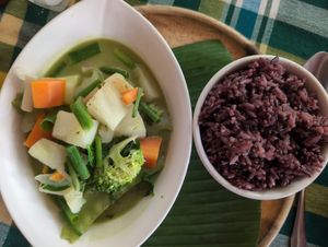 Green curry & purple rice at Two Little Birds in Luang Prabang