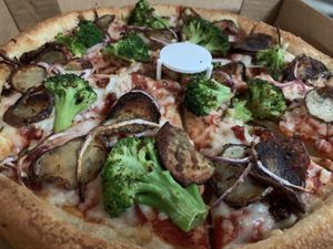 So many fantastic toppings available plus vegan cheeze! 🥦🍕🌱  at Mother Bear's - Campus in Bloomington