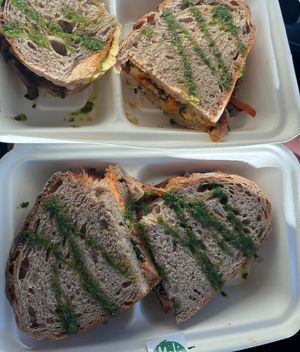 Hummus Toast and Tofu, Spinach, Sun Dried Tomato Toast (to go)   at Mela Canela in Sintra