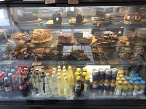 The top shelf has vegan options which are clearly marked   at Cinnamon Coffee Shop in London