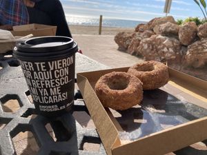  Vegan cinnamon donuts w/ vegan latte macchiato at the beach ( Playa la carihuela ) at Naranjito in Torremolinos