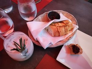 Bread basket with olive tapenade & vegan holiday cocktail at Lamoraga in Naples