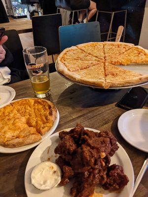 Fantastic Pizza with different vegan cheese options. at Rise Above Pizza & Wings in Hamilton