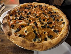 Pepperoni with olives at Rise Above Pizza & Wings in Hamilton