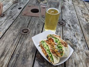 Buffalo crunch wrap with beer from brewery next door. at Toasty in Bend