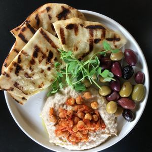 White bean hummus, grilled flatbread, chickpea salad, roasted tomato harissa  at Murray Circle in Sausalito