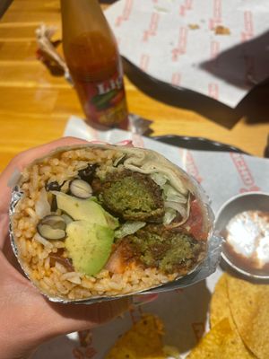 Falafel burrito, made vegan without cheese and sour cream (and they added avocado!) it was huge and delicious!! They serve beer and nachos with fresh made guacamole here too at Macho Grill in Jeju