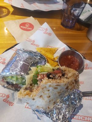 Huge and delicious portions. I tried but couldn't finish the vegan burrito. at Macho Grill in Jeju