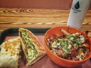 gordita and chilli fries and water  at BeetBox in Vancouver