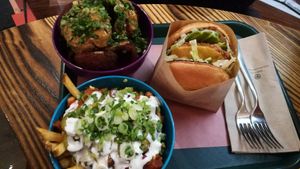 Onion rings, chilli cheese fries, chickun burger at BeetBox in Vancouver