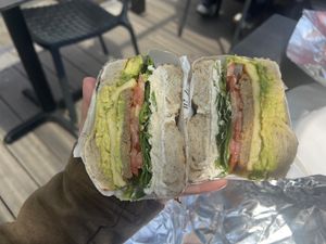 GF everything bagel, vegan egg and sausage, tofu cream cheese, tomato, spinach and avocado! Very tasty!!  at Bagel Point in Brooklyn