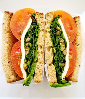 Caprese sandwich
{Baked Tomato, Basil, Capers, Spinach Balsamic Vinaigrette. Served on sliced 7-grain bread.} at Bagel Point in Brooklyn