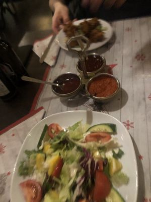 Starters mixed salad & pakora fritters w a sweet and spicy sauce  at Indian Palace in Olten
