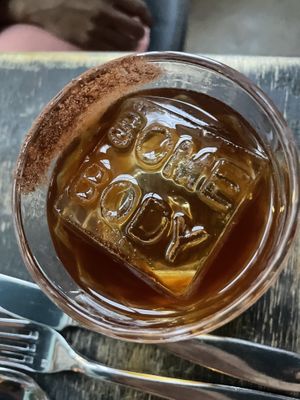 Cocktail with mezcal and great ice at Somebody People in Denver