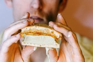 house made basil ice cream and marmalade sandwiched between two almond cookies at Somebody People in Denver