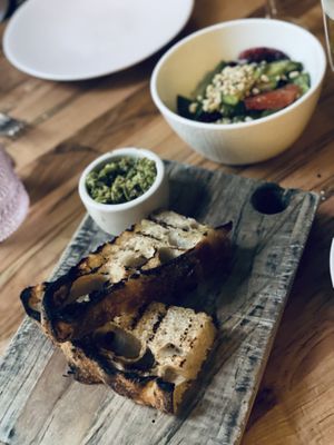 Bread, cucumber salad  at Somebody People in Denver