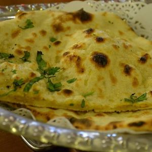 Freshly cooked naan bread at Bollywood Taco in Jinan