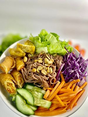 The vegan summer noodles with brown rice, spring roll, vietnamese pickle and raw veggies, it goes with peanut sauce or tamarind sauce. at Khong Vegan Restaurant  in Da Nang