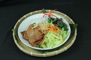Meat-Imitation of Pork Belly base on Soybeans with Rice noodle salad and fresh herbs at Hanoi Pho in Mannheim