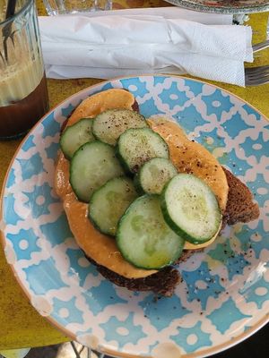 wholegrain bread with hummus cucumber and olive oil at Little Big House in Thessaloniki