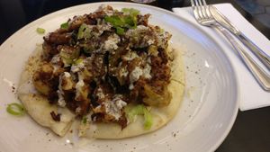 Cauliflower pizza with eggplant at EWR - Flora - TC in Newark