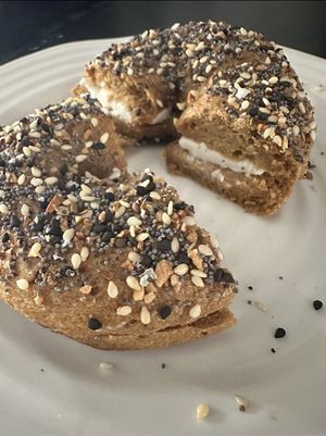 Gluten free sourdough everything bagel with vegan cream cheese  at Uprising Bakehouse in Burlington