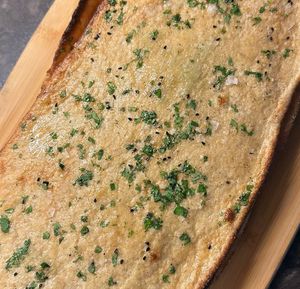 Gluten free sourdough garlic naan  at Uprising Bakehouse in Burlington