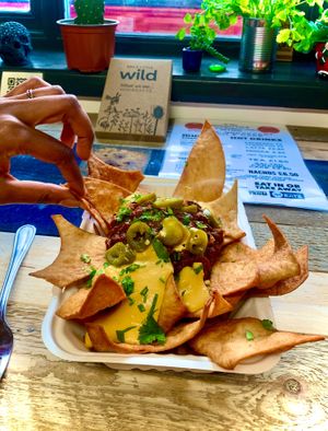 Our nachos topped with Oaxaca inspired chilly and a nacho cheeeez sauce  at Tacos and Flipflops - Pop-up in Peterborough